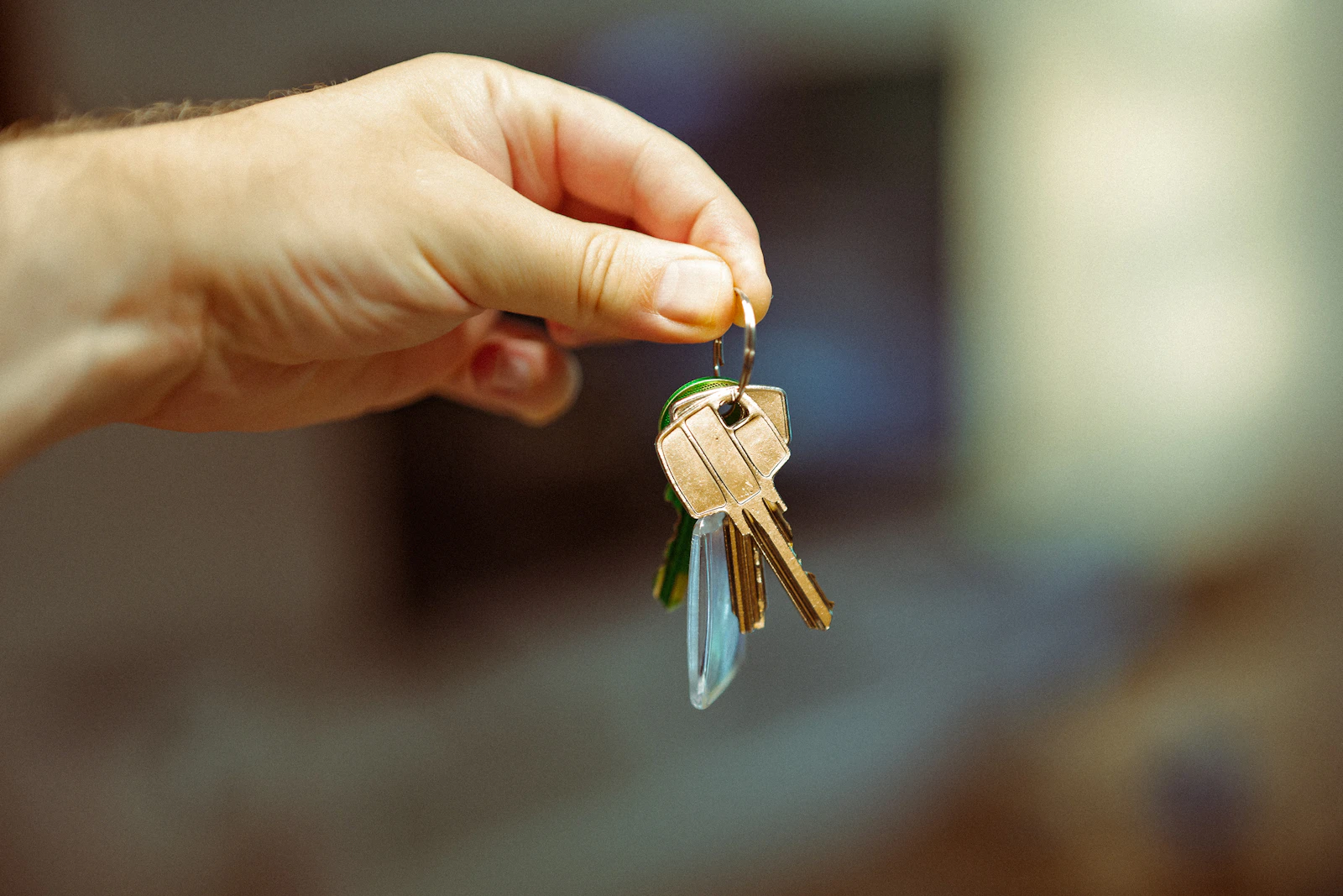 A hand holding out a bunch of keys, representing who holds the keys to a business's domain name